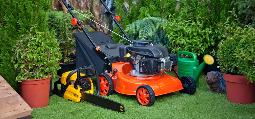 photo of a lawn mower sitting on grass